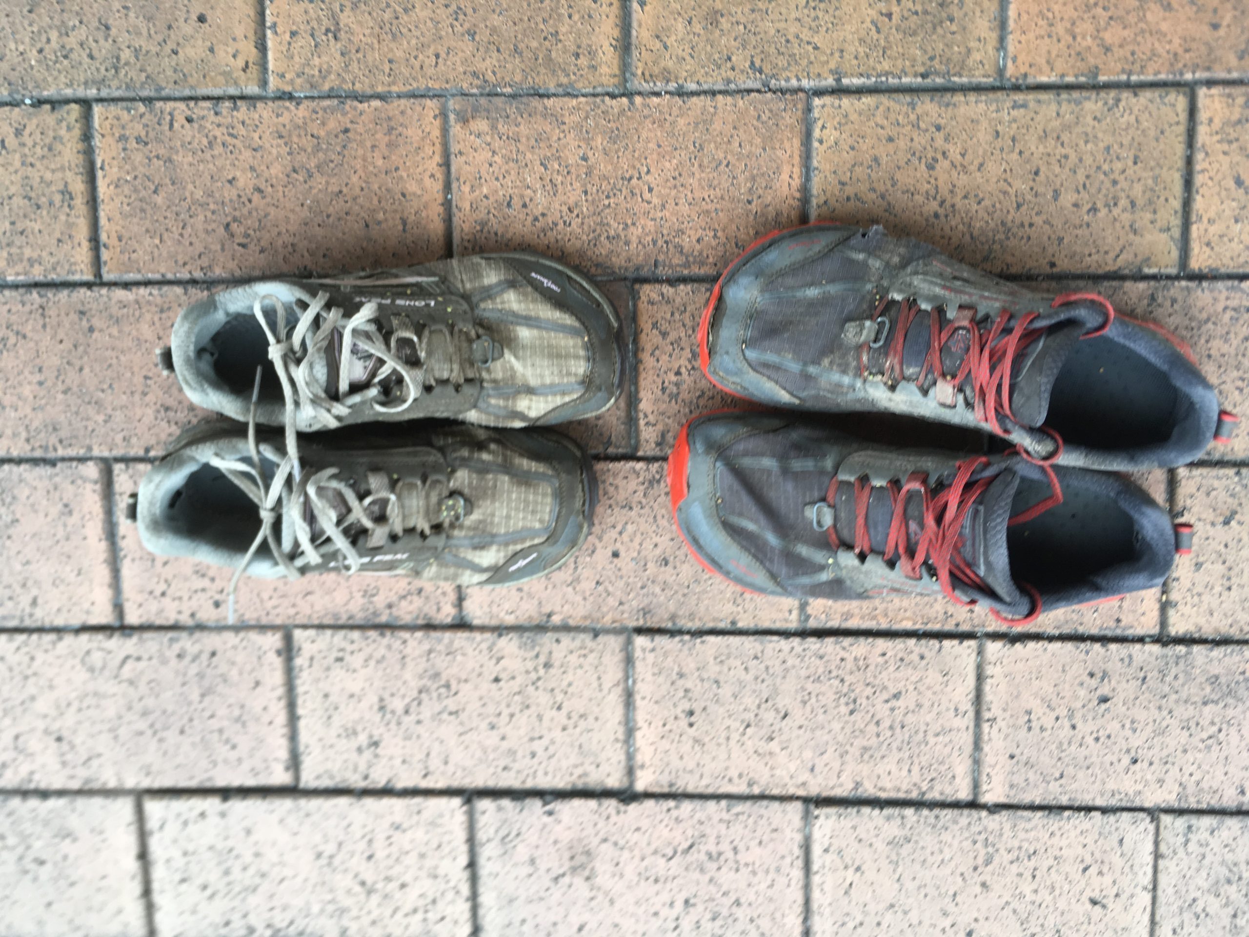 Used Hiking shoes on brick path