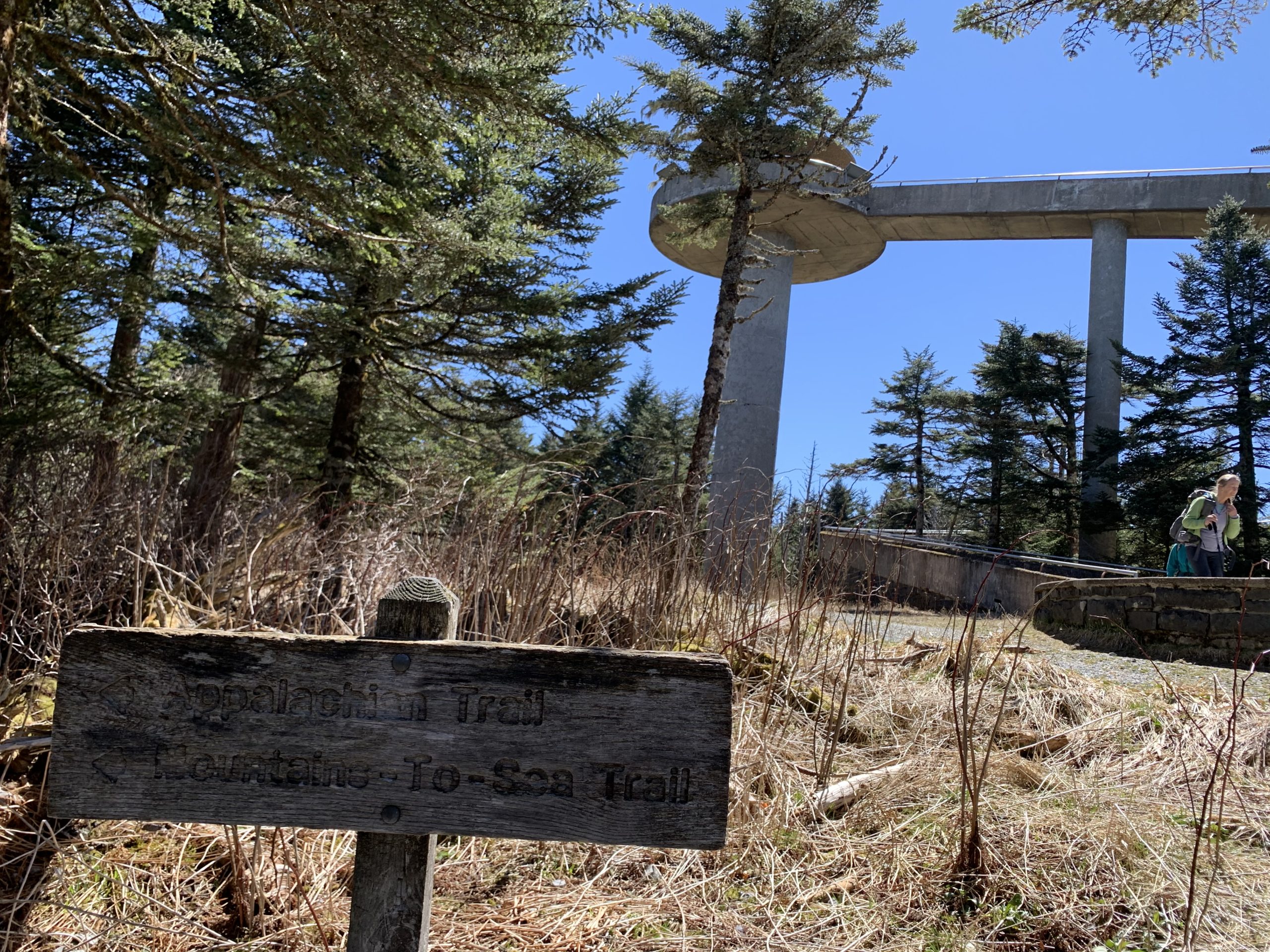 Mountains-to-Sea Trail sign in the foreground, and Clingman’s Dome tower in the background.