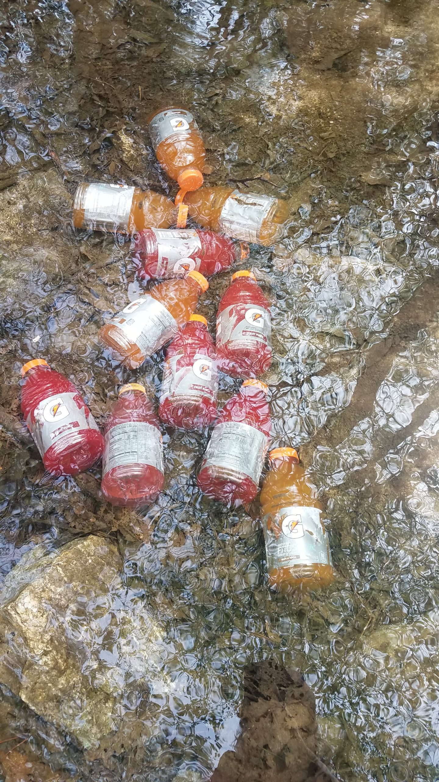 A cache of gatorades for hikers left in a stream