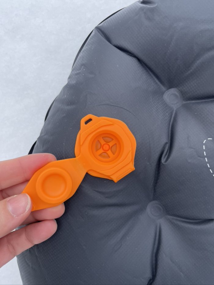 orange stacked valve of sea to summit ether light xt extreme sleeping pad with cap open