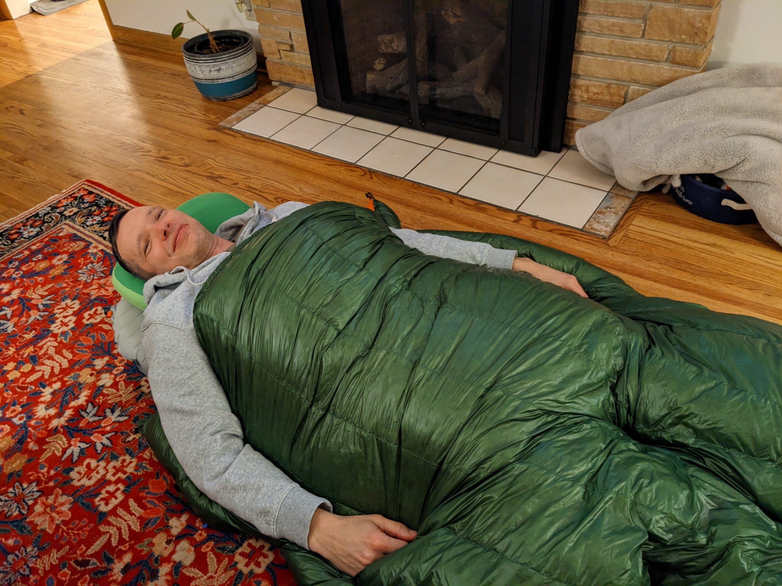 Me testing out my sleep system in my living room.