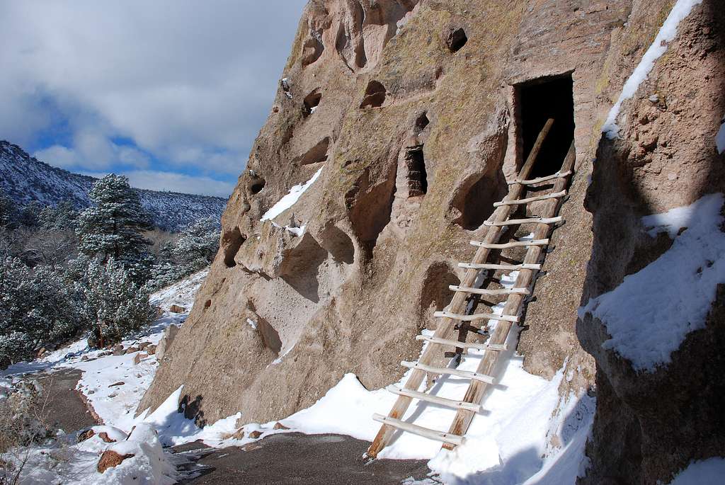 best day hikes in the mountain west: wooden ladder leading into square entrance cut in rock face