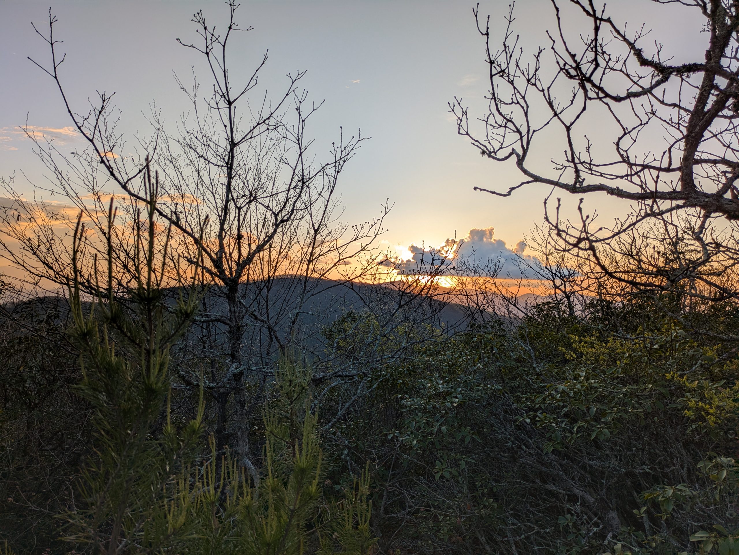 A sunset over a mountain view.