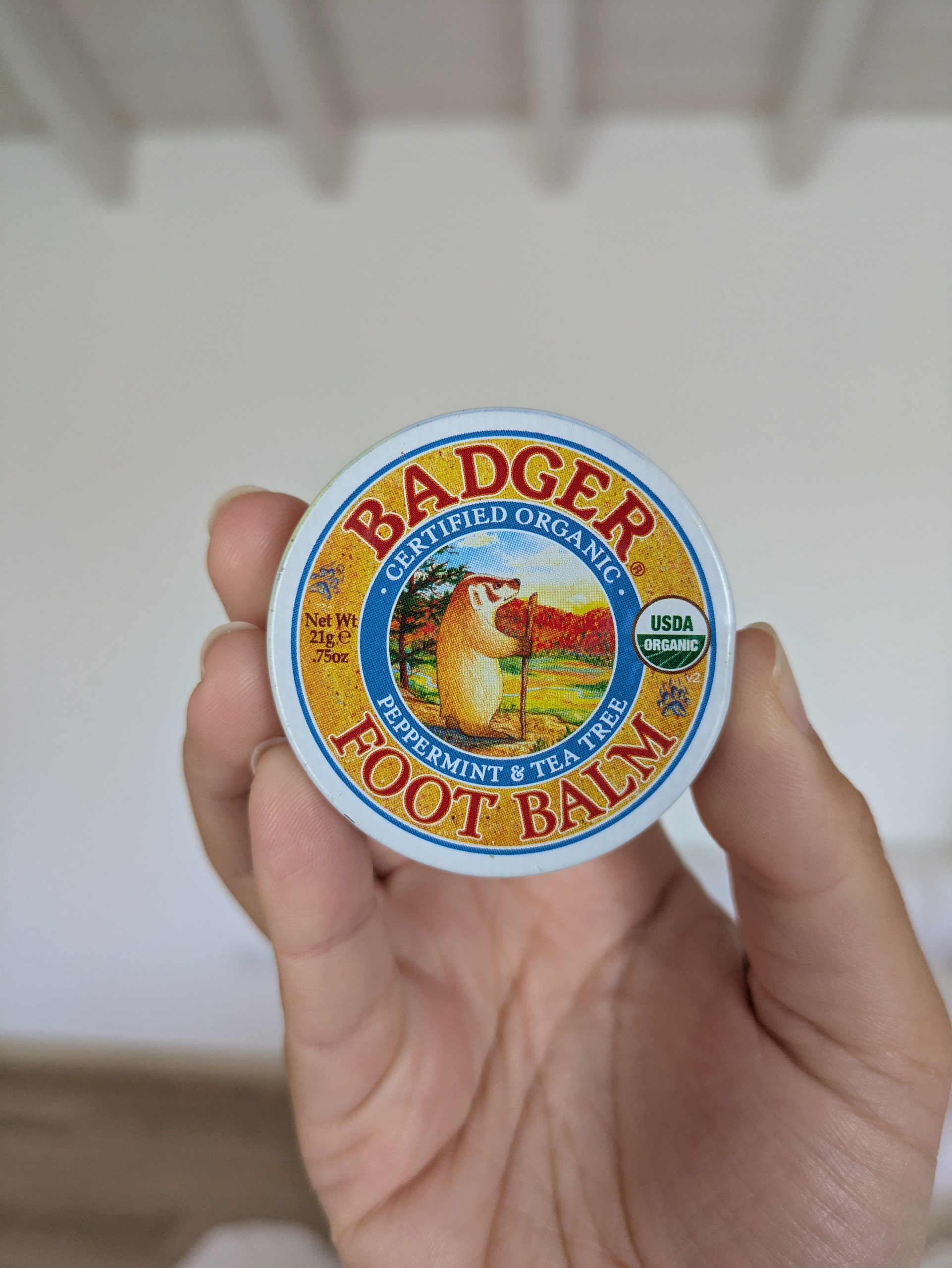 Forestry of the balm can of the feet on a wooden table, used to prevent blisters while walking along the path of fishermen.