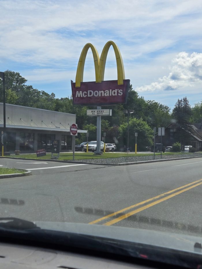 McDonalds Golden Arch sign as seen from a car