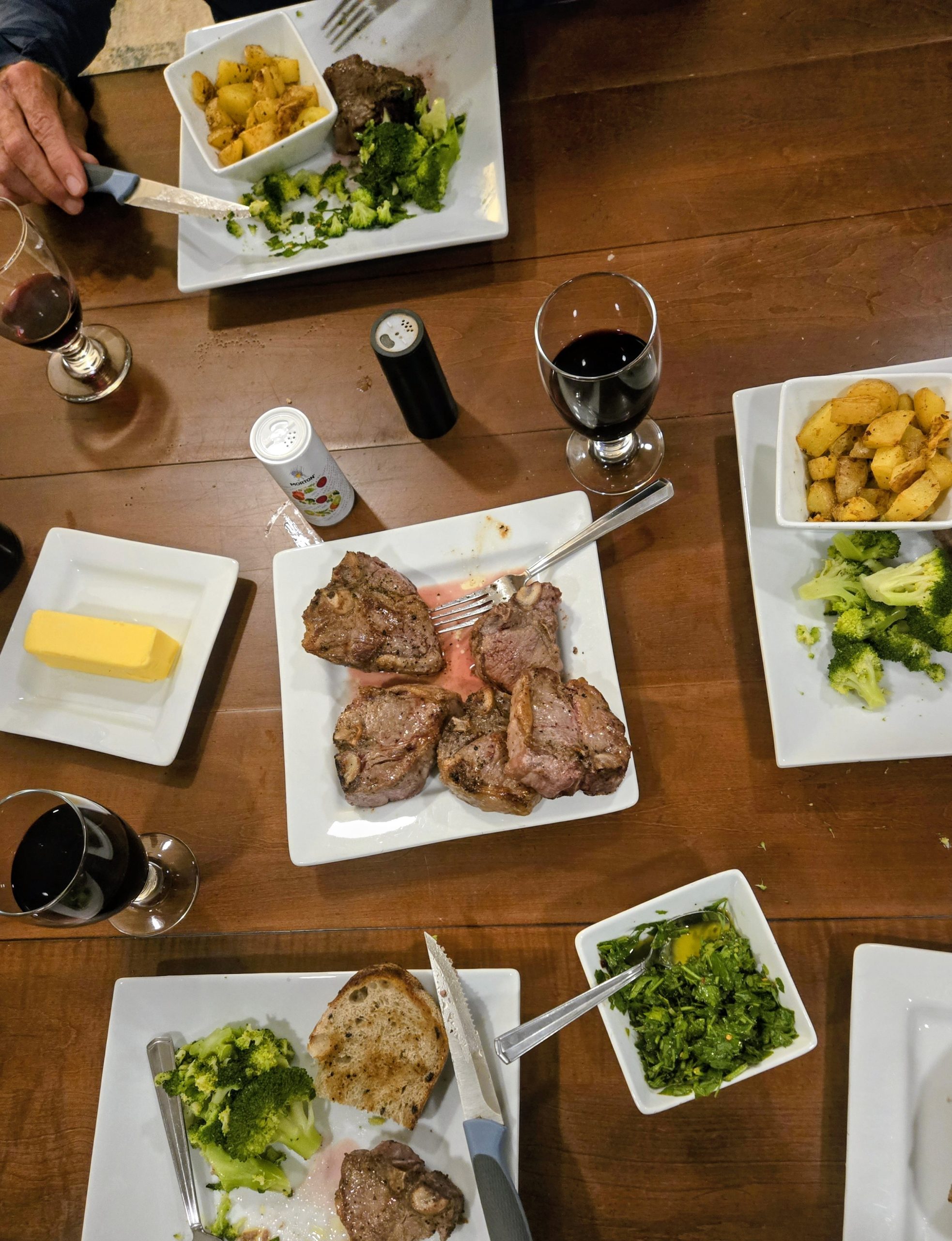 Lamb chops, broccoli, and potatoes served family style