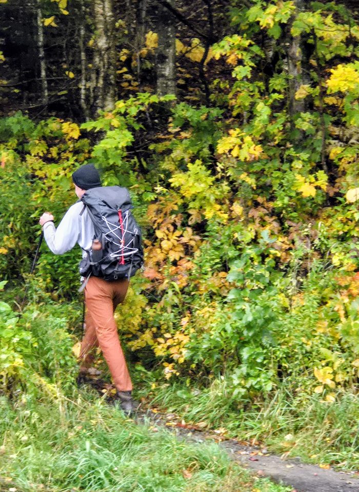 Backpacker heading into the woods